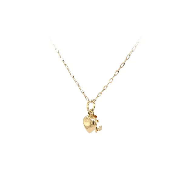 Mặt dây chuyền vàng hình trái tim, neo và thánh giá