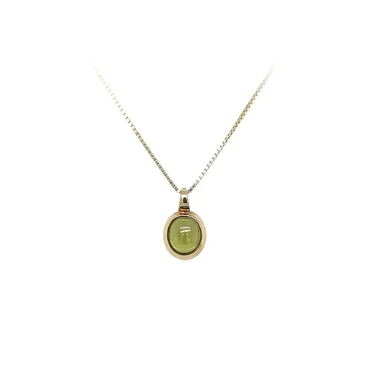 Mặt dây chuyền vàng đính đá xanh